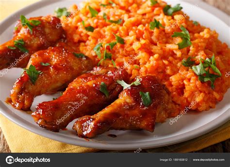 Nigerian food: spicy Jollof rice with fried chicken closeup. hor — Stock Photo © lenyvavsha ...