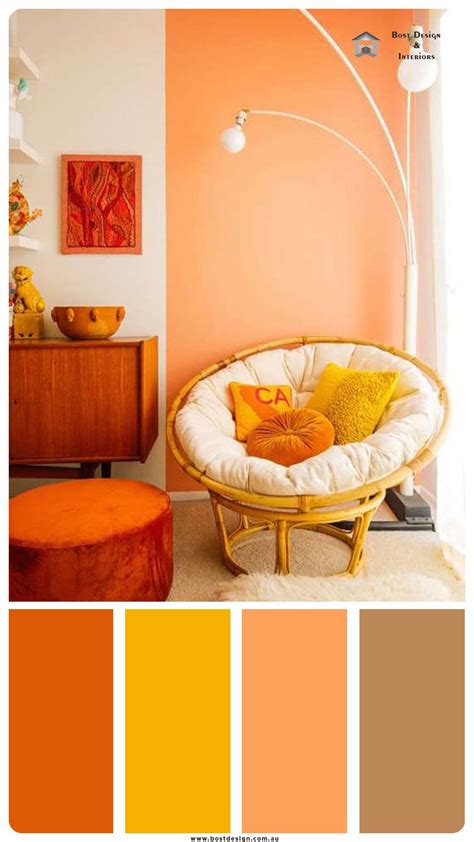 a living room with orange and yellow colors in the walls, furniture and decor items