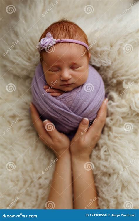 Newborn Baby Girl is Sleeping in a Cocoon Pose Potato Bag in His Mother ...