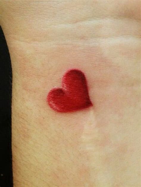 Pin by emma ali on tats + piercings in 2023 | Red heart tattoos, Heart tattoo wrist, Purple ...
