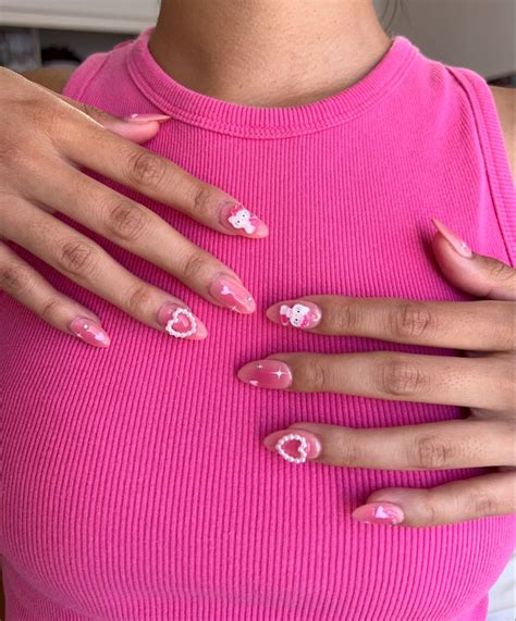 hello kitty pink aura nails 🎀 | Hello kitty nails art, Hello kitty nails, Pink glitter nails