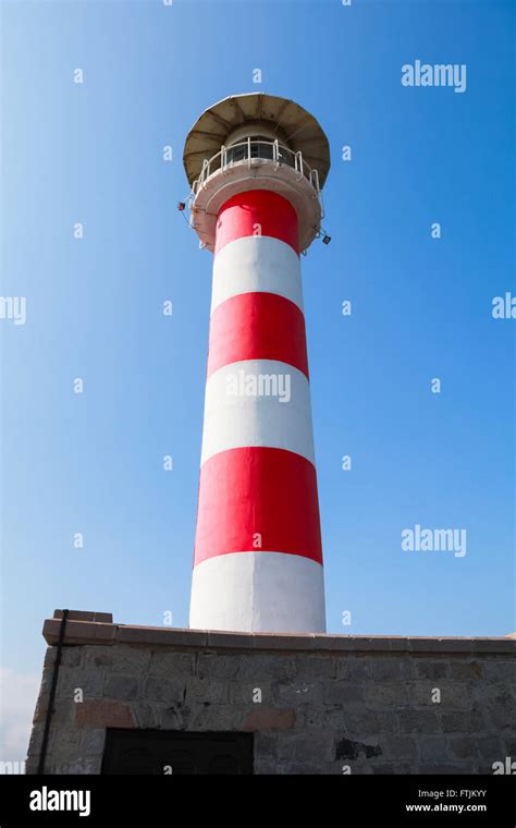 Red and white striped lighthouse tower in port of Burgas, Black Sea coast, Bulgaria Stock Photo ...