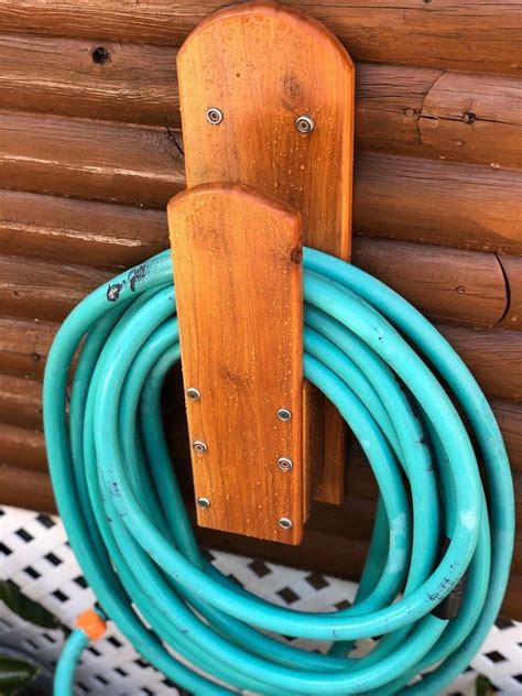 Pin by Bekhechi on Bricolages en bois | Garden hose holder, Woodworking, Woodworking projects