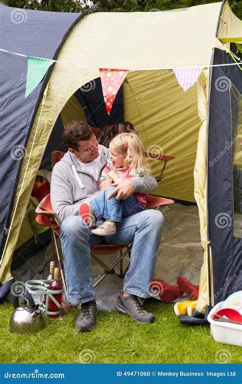 Father And Daughter Enjoying Camping Holiday On Campsite Stock Photo - Image: 49471060