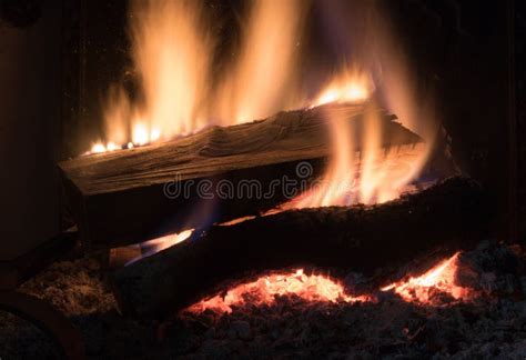 Burning Fire Wood Logs in Fireplace Stock Photo - Image of ashes, dark ...