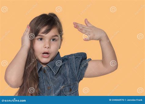 Surprised Tanned Little Girl is Posing on Orange Background Stock Photo - Image of face, long ...