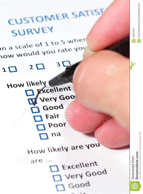 someone filling out a survey form with a pen