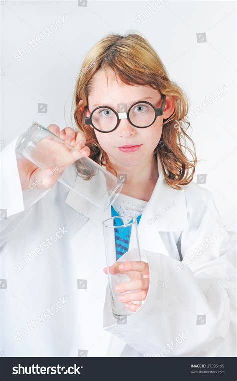 Young Girl In Oversize Lab Coat Working On Science Experiment Stock ...