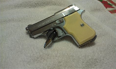 Dad's old Titan 25 cal pistol : guns