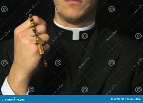 Young Priest Praying with Rosary Stock Photo - Image of crucifix ...