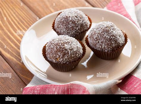 Chocolate balls in coconut shavings close up Stock Photo - Alamy