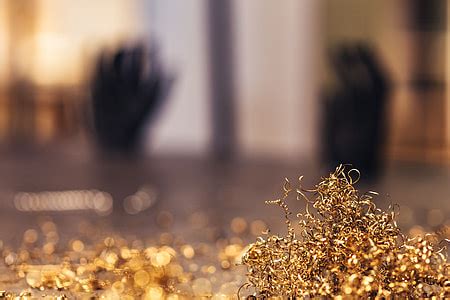 Royalty-Free photo: Close-ups of golden metal shavings on a table | PickPik