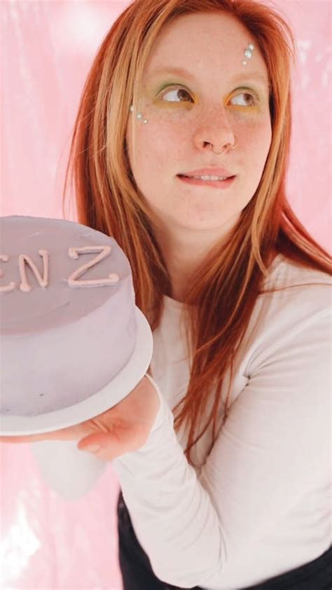 Young Woman Smiling While Holding a Cake · Free Stock Video