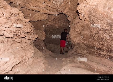 Tourist in the salt caves, Valle de la Luna (Moon Valley), San Pedro de ...