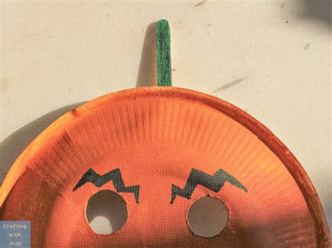 Paper Plate Pumpkin Mask for an Easy Halloween Craft