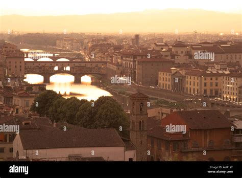 The River Arno and the Ponte Vecchio at sunset Stock Photo - Alamy