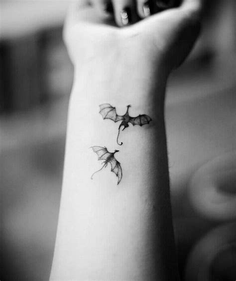 two-dragons-flying-small-wrist-tattoo-dragon-tattoo-design-black-white ...
