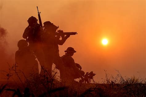 Premium Photo | The silhouette of a military soldier with the sunset