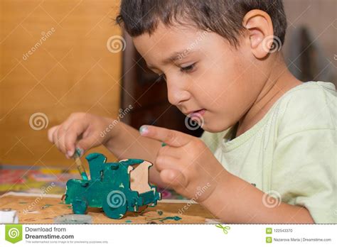 Boy is Painting a Wooden Toy Car Stock Photo - Image of pastime ...