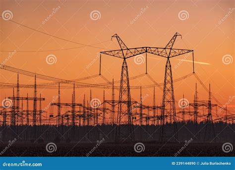 Silhouettes of Electric Power Lines at Sunset Stock Photo - Image of ...