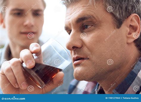 A Man with a Glass of Alcohol. Stock Photo - Image of social, despair: 198127904
