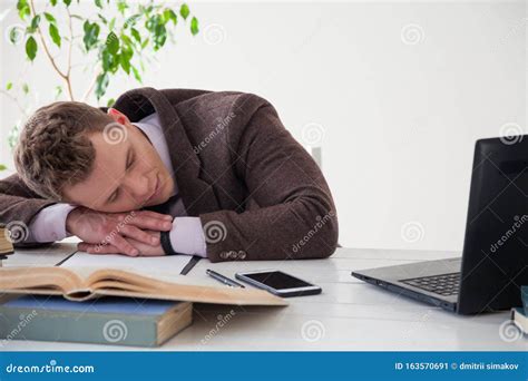 Portrait of a Handsome Business Man Sleeping at Work in the Office ...