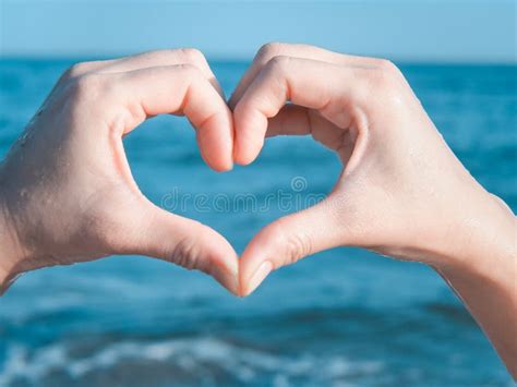 Heart from Hands on the Beach Stock Image - Image of male, exercise: 107718821