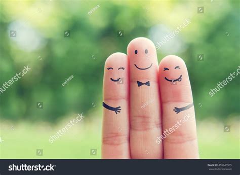 Happy finger art family group of loving mother and father with son while smiley face at blurred ...