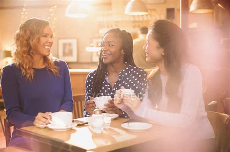 Women friends drinking coffee and talking at cafe table — Soft Focus, friendship - Stock Photo ...