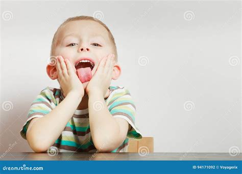 Kid Making Funny Faces Being Bored Stock Photo - Image of tired, childhood: 94171092