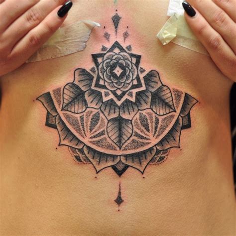 Black and grey geometric dotwork sternum mandala tattoo by Chris Jones Tattooer. Done at Vic ...