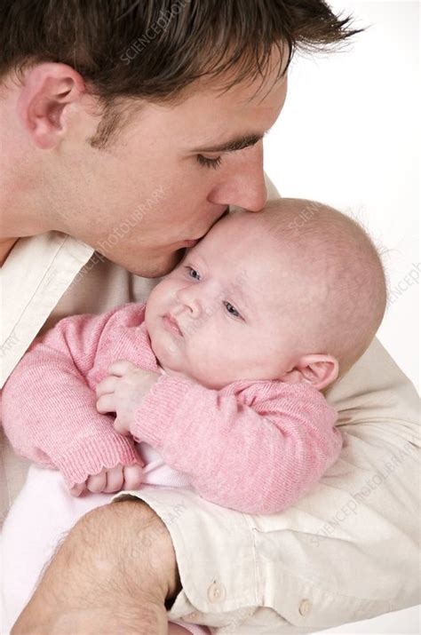 Father kissing his baby - Stock Image - C001/8885 - Science Photo Library