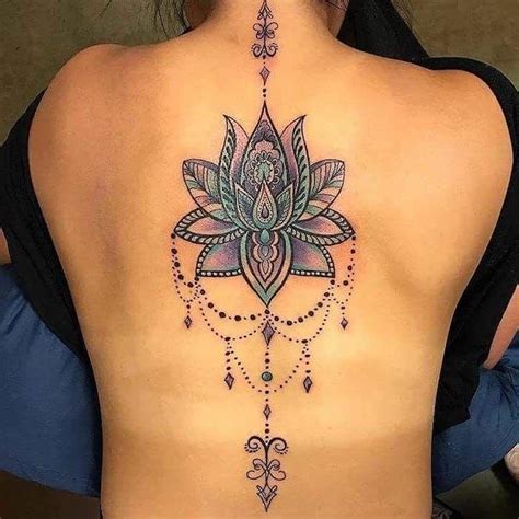 mandala tattoo meaning, colourful lotus, back tattoo, black top, blue cushions | Creative ...