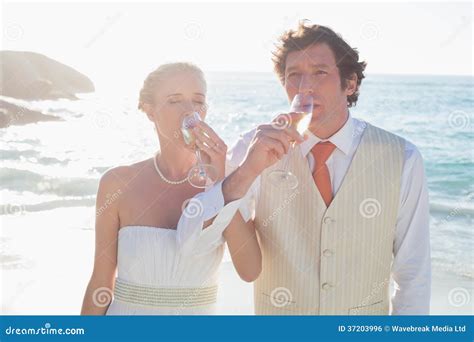 Young Newlyweds Drinking Champagne Linking Arms Stock Photo - Image of wedding, bright: 37203996