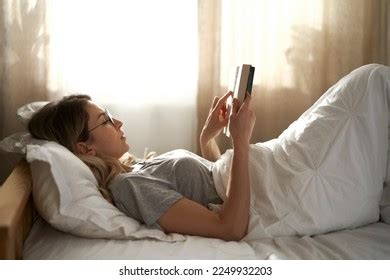 Caucasian Woman Lying Down Bed Reading Stock Photo 2249932203 ...