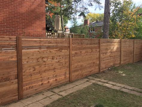 NDG, Brown Pressure Treated, Horizontal Fence, with trims on post and custom smaller slats ...