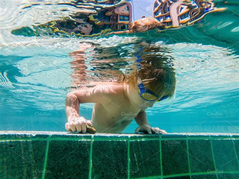 A child boy is swimming underwater stock photo containing under and ...