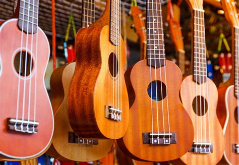 Row of colorful ukulele hanging at the Maui Ukulele Festival - pmimaui