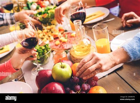 A large family at a festive table eating together Stock Photo - Alamy