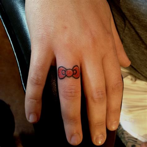 Hello kitty now tattoo | Hello kitty tattoos, Hello kitty bow, Finger ...