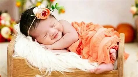 Smiling Cute Baby Girl Child Is Sleeping On Little Bed Wearing Light ...