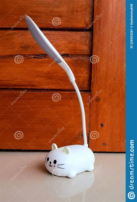 Cute white cat study lamp stock image. Image of homework - 226953281