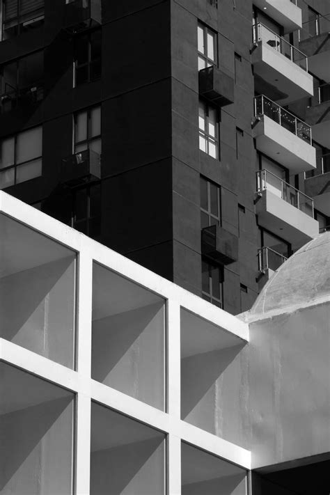 a black and white photo of an apartment building