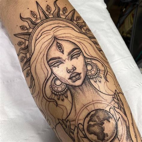 a woman's arm with tattoos on it