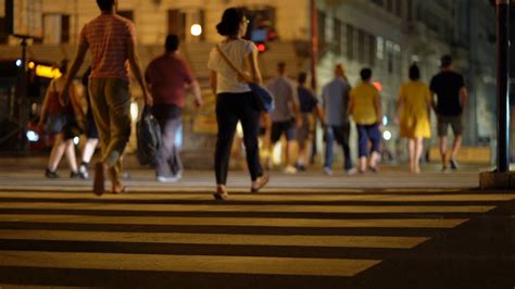 People crossing street. Pedestrians crossing crosswalk in city Rome ...