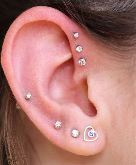 Mackenzie came by today for a new Triple Forward Helix! Keeping it ...