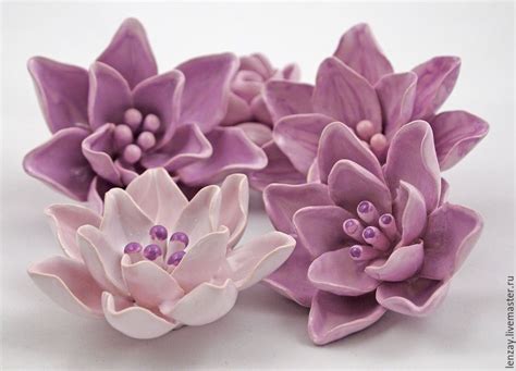 purple and white ceramic flowers on a white surface