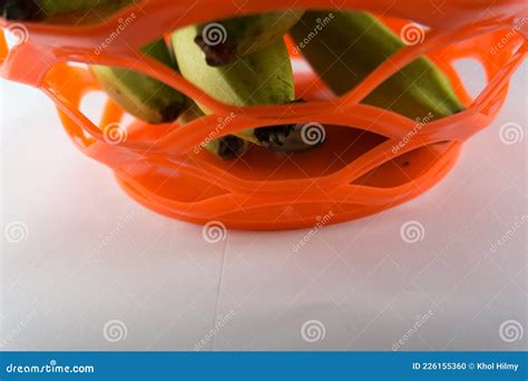 Bunch of Fresh Green Ambon Bananas in a Fruit Basket Isolated on a Blue ...