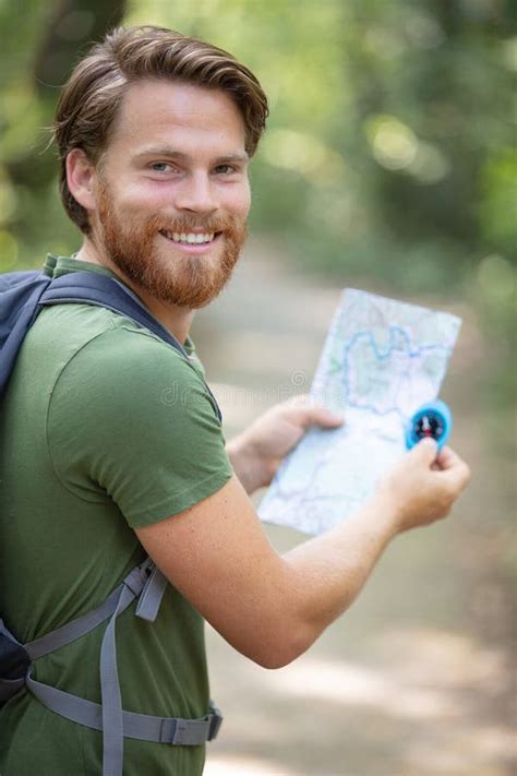 Hiker in Forest with Compass and Map Stock Image - Image of equipment, male: 272481929