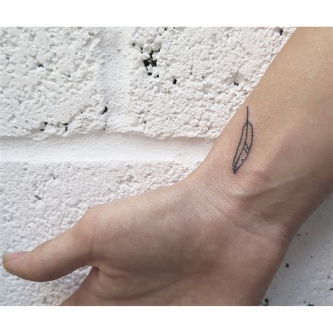 Stick and poke feather tattoo - Tattoogrid.net